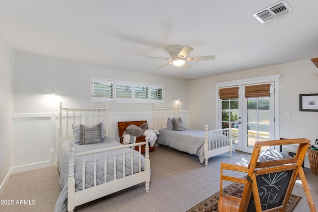 bedroom featuring visible vents, a ceiling fan, access to outside, french doors, and carpet