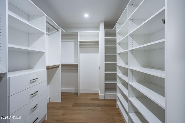 spacious closet with wood finished floors