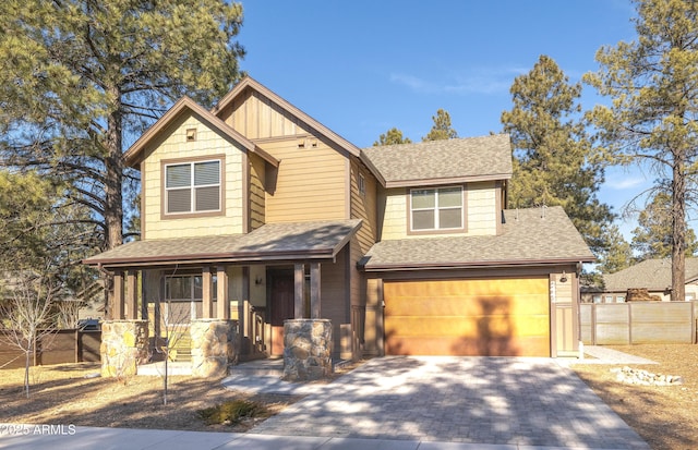 view of front of property featuring covered porch and a garage