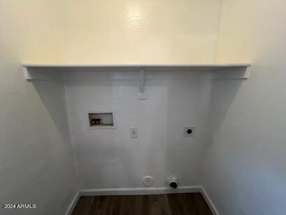 washroom with hookup for an electric dryer, dark hardwood / wood-style floors, and hookup for a washing machine