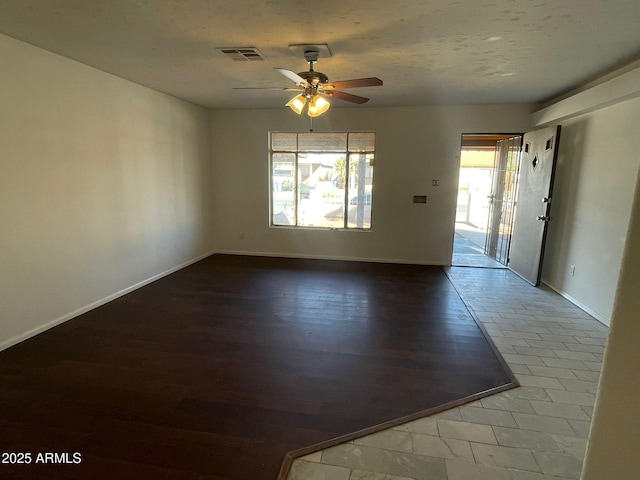 spare room featuring ceiling fan