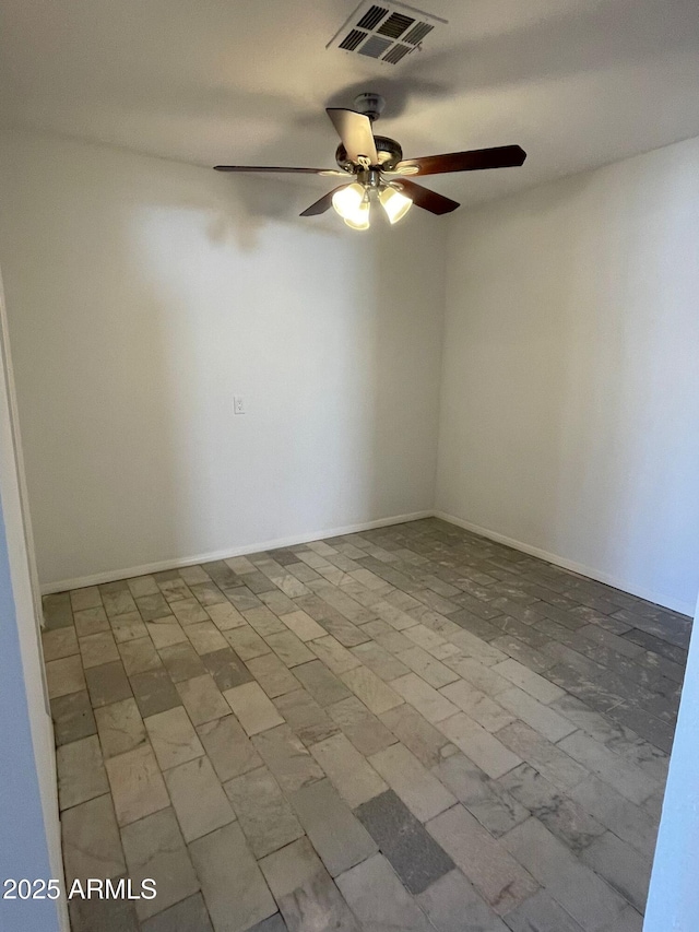 empty room featuring ceiling fan