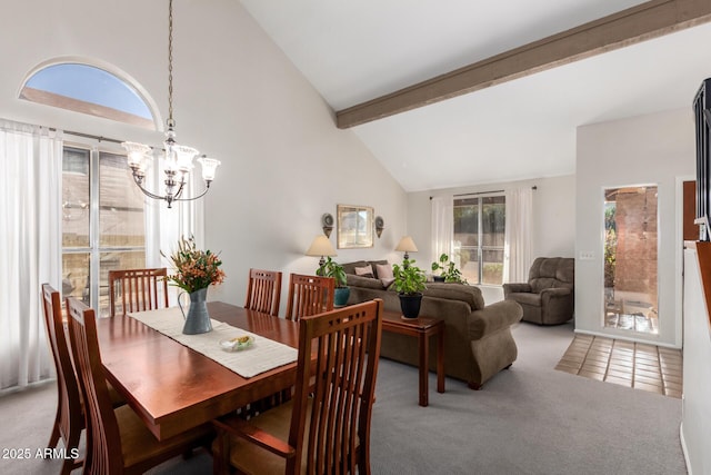 dining area with an inviting chandelier, carpet, high vaulted ceiling, and beam ceiling