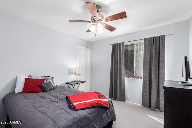 bedroom with ceiling fan and carpet