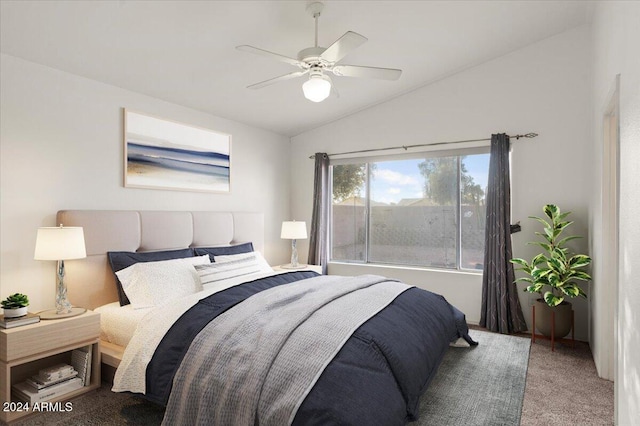 bedroom with ceiling fan, carpet floors, and vaulted ceiling