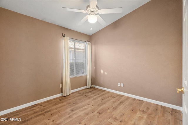 unfurnished room with light hardwood / wood-style floors, ceiling fan, and lofted ceiling