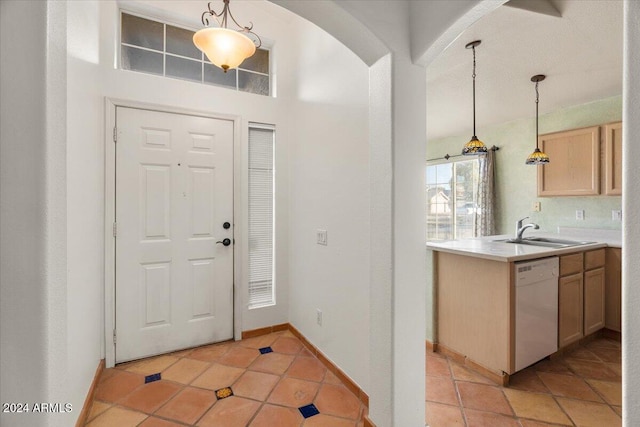 tiled entrance foyer with sink