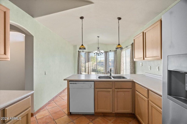 kitchen with white dishwasher, sink, hanging light fixtures, light tile patterned floors, and a chandelier