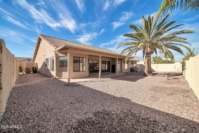 rear view of house featuring a patio