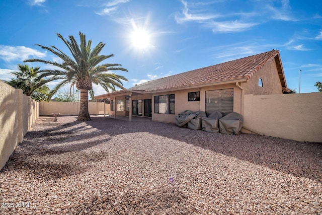 rear view of house featuring a patio