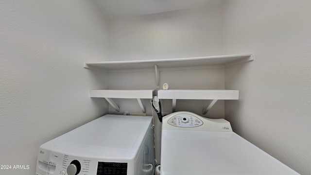 washroom with independent washer and dryer