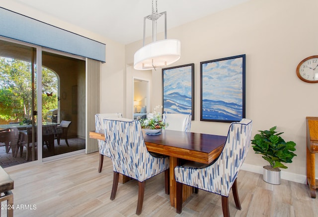 dining room with light wood-type flooring