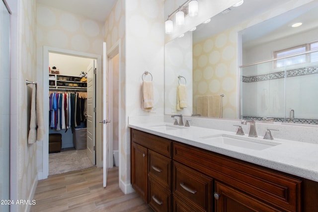 bathroom featuring oversized vanity and dual sinks