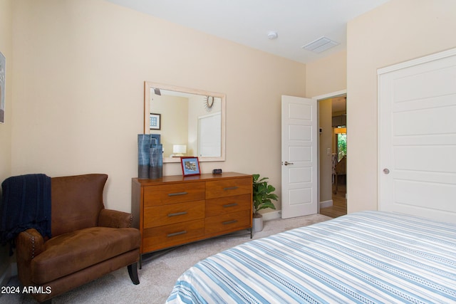 bedroom with light carpet