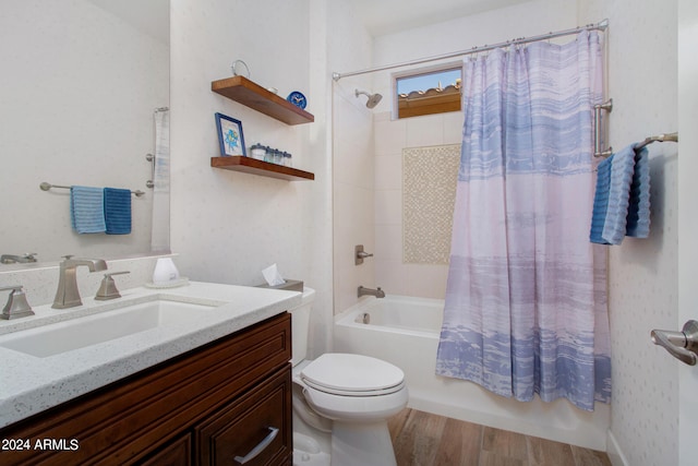 full bathroom with shower / bathtub combination with curtain, toilet, hardwood / wood-style floors, and vanity