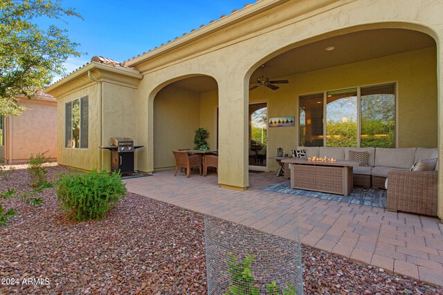 view of patio / terrace featuring ceiling fan, area for grilling, and an outdoor living space