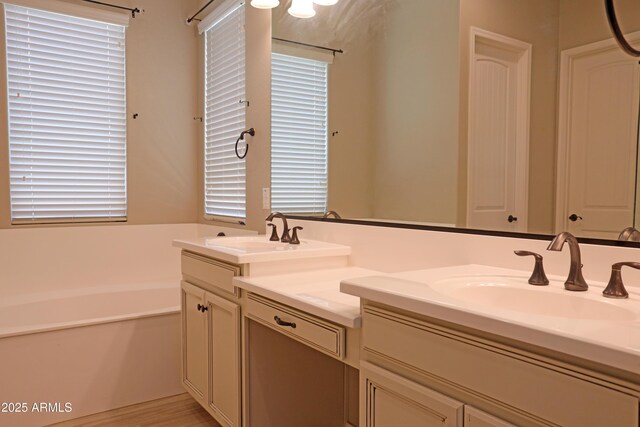 2811 S Jeffry St, Gilbert, AZ 85295 - full bathroom with double vanity, a bath, and plenty of natural light
