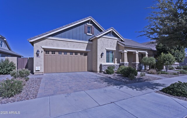 2811 S Jeffry St, Gilbert, AZ 85295 - craftsman inspired home featuring driveway, an attached garage, a tile roof, stucco siding, and a porch
