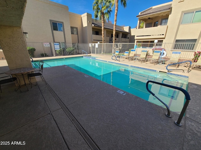 view of swimming pool featuring a patio area