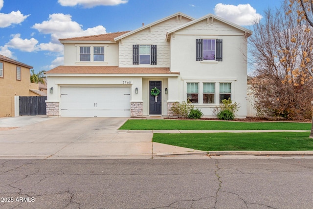 view of front facade with a garage and a front lawn