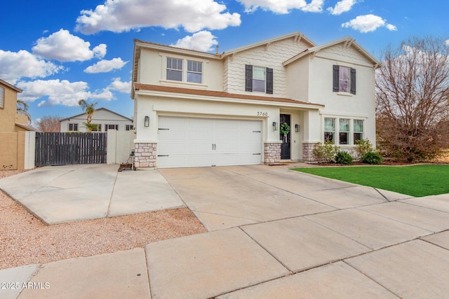 view of front of home featuring a garage and a front lawn