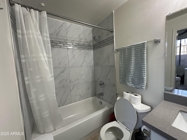 bathroom featuring vanity, shower / tub combo with curtain, toilet, and a textured wall