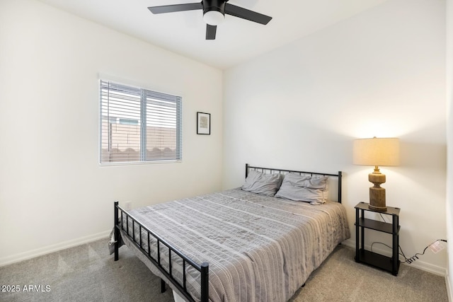 bedroom with carpet flooring, a ceiling fan, and baseboards