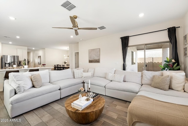 living area featuring ceiling fan, recessed lighting, visible vents, and wood tiled floor