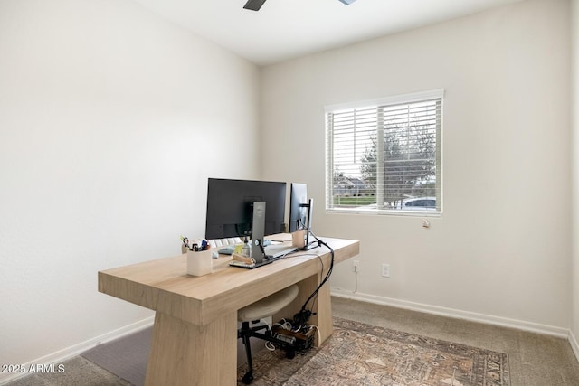 office with carpet flooring, a ceiling fan, and baseboards