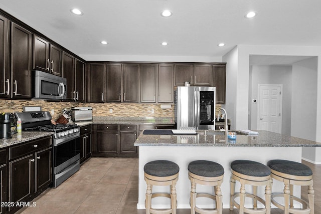 3436 E Gary Way, Gilbert, AZ 85234 - kitchen with light stone countertops, stainless steel appliances, and tasteful backsplash