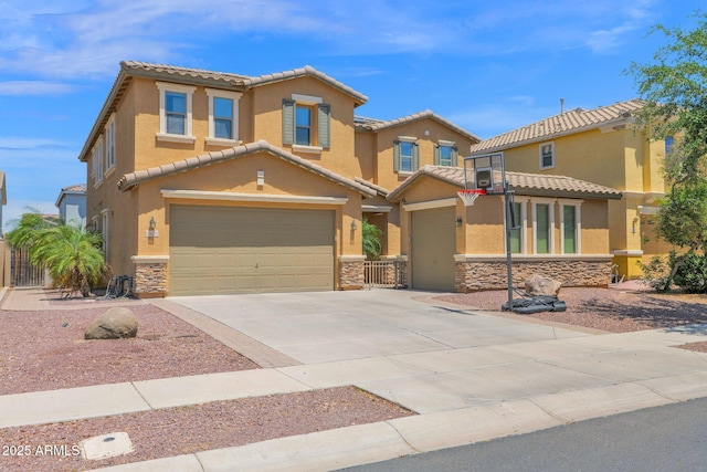 3436 E Gary Way, Gilbert, AZ 85234 - view of front of house featuring driveway, an attached garage, stucco siding, a tile roof, and stone siding