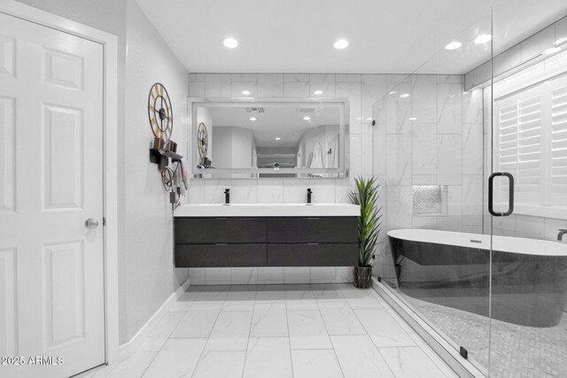 3436 E Gary Way, Gilbert, AZ 85234 - bathroom with marble finish floor, baseboards, recessed lighting, a freestanding bath, and double vanity