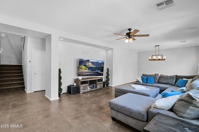 3436 E Gary Way, Gilbert, AZ 85234 - living room featuring stairs, ceiling fan with notable chandelier, baseboards, and visible vents
