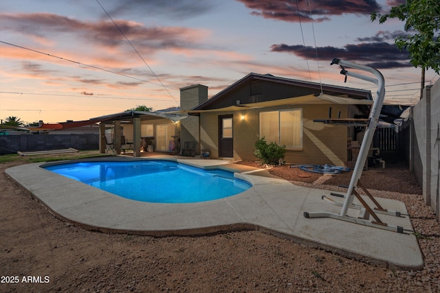 view of swimming pool featuring a patio and a fenced backyard