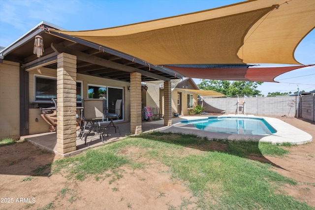 view of pool featuring a patio and a fenced backyard