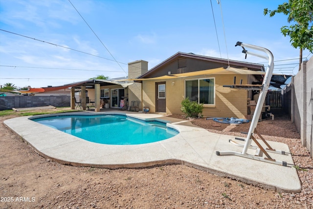 back of property with a patio and a fenced backyard