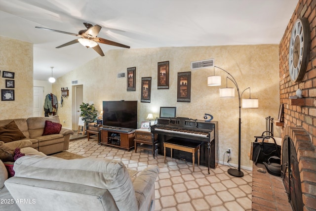 living room featuring lofted ceiling, ceiling fan, a fireplace, and baseboards