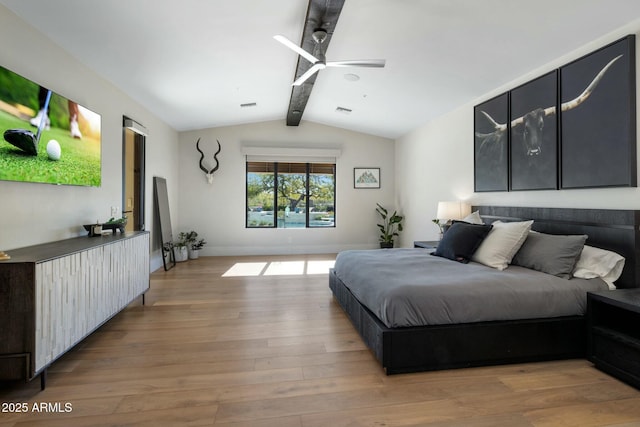 bedroom with light wood-style flooring, baseboards, vaulted ceiling with beams, and visible vents