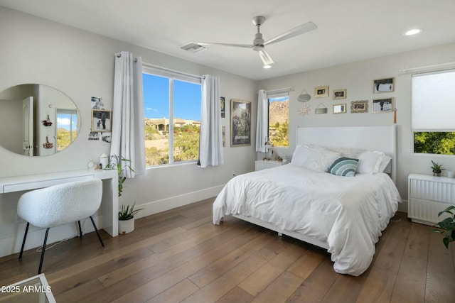 bedroom featuring wood-type flooring, baseboards, recessed lighting, and visible vents