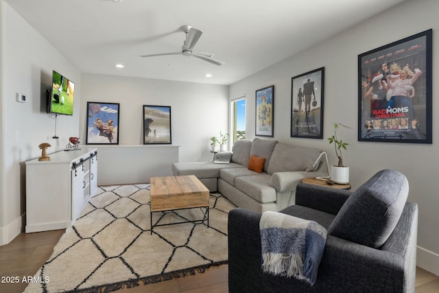 living room featuring recessed lighting, a ceiling fan, and wood finished floors