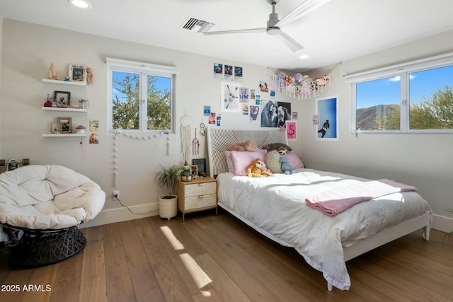 bedroom featuring baseboards, recessed lighting, visible vents, ceiling fan, and wood-type flooring