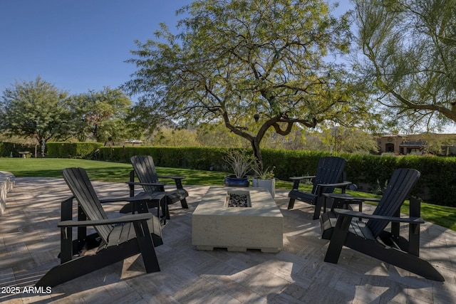 view of patio / terrace featuring an outdoor fire pit