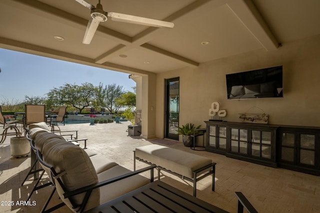 view of patio / terrace featuring a swimming pool, ceiling fan, and an outdoor hangout area