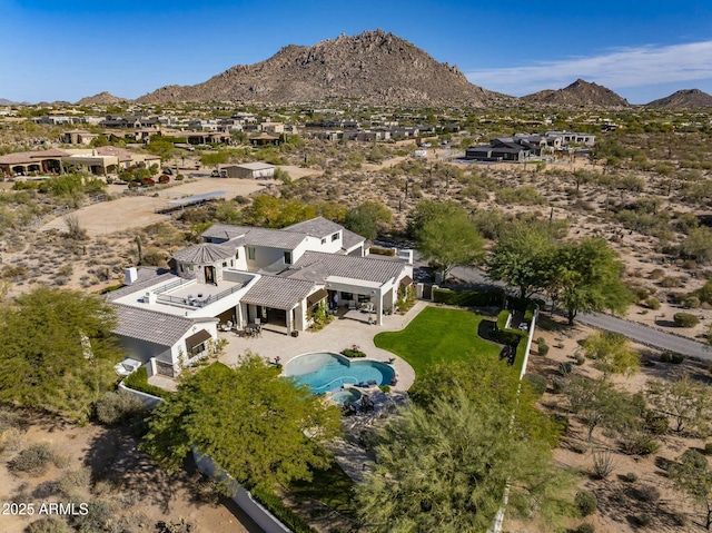birds eye view of property with a mountain view
