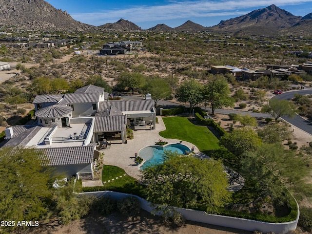 birds eye view of property with a mountain view
