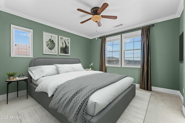 carpeted bedroom featuring ceiling fan and ornamental molding