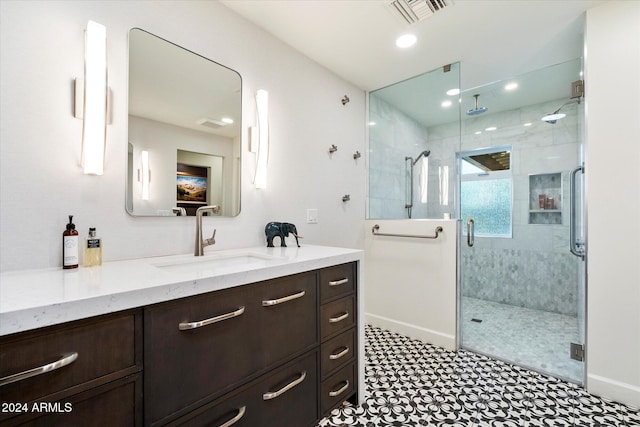 bathroom with vanity and an enclosed shower