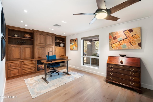 office with ceiling fan and light wood-type flooring