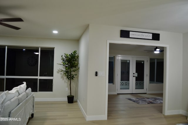 interior space featuring light wood-type flooring and french doors