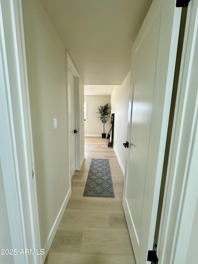 hallway with light wood-type flooring